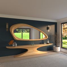 a large mirror sitting on top of a wooden shelf next to a window in a living room