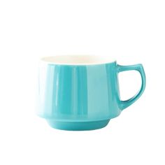 a teal colored coffee cup on a white background