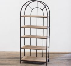 an iron and wood shelf with four shelves