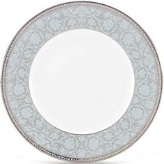 a white and blue plate with silver trim