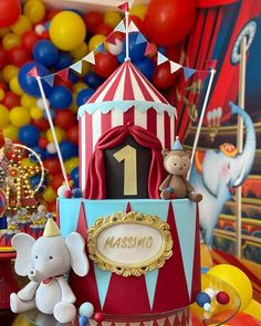 a circus themed birthday cake with stuffed animals