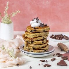 a stack of pancakes with chocolate chips and marshmallows