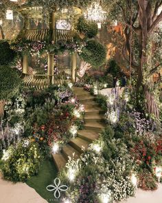 an artistic rendering of a garden with stairs leading up to trees and flowers on the ground