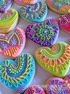 decorated heart shaped cookies on a table