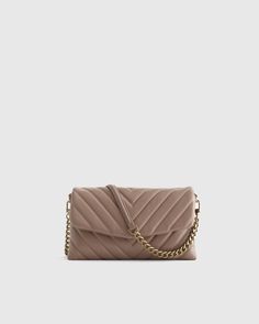 Think of this as the cherry on top of your evening look. Made of ultra-soft 100% Italian leather with a stylish quilted design, this piece will elevate any ensemble. And it boasts six card slots and a center zip pocket to hold all the essentials. Wear as a chic crossbody or remove the detachable chain to make a cute clutch. Taupe Bag, Quilted Wallet, Dark Taupe, Sheep Leather, Cherry On Top, Wallet Bag, Perfect Bag, Everyday Bag, Quilted Leather