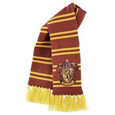 a harry potter scarf with a hogwarts crest on the front and yellow fringe