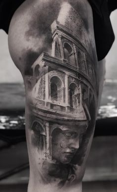 a man's leg with a black and white photo of a building on it