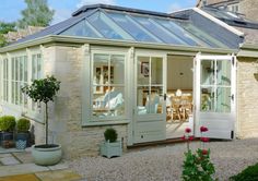 a house with a glass roof and white doors