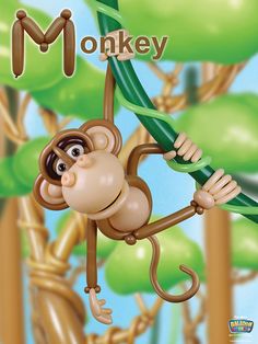 a monkey hanging from a tree branch with the word monkey on it's back