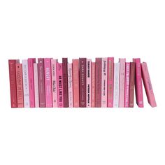 a row of pink books sitting on top of each other