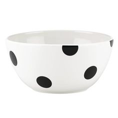 a white bowl with black polka dots on it