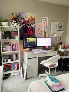 a bedroom with a desk, computer and bookshelf