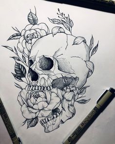 a drawing of a skull with flowers on it