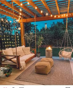 an outdoor living area with swings and lights