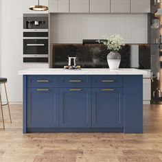 a kitchen with blue cabinets and white counter tops