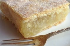 a close up of a piece of cake on a plate with a fork