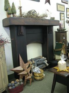 a living room filled with furniture and a fire place