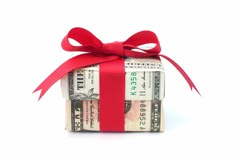 money wrapped in red ribbon on white background