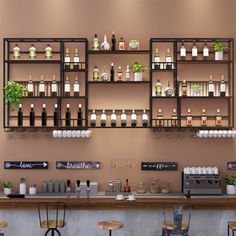 an empty bar with several bottles on the wall