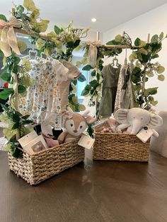 two baskets filled with stuffed animals sitting on top of a wooden table