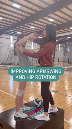 two girls standing on top of a wooden box in an indoor volleyball court with the words improve armswing and hip rottation