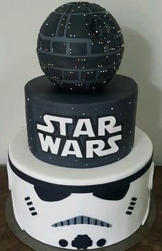 a star wars themed cake with a helmet on top