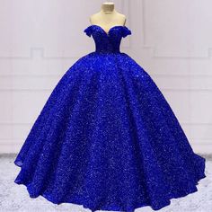 Step into the spotlight with this dazzling Ball Gown Quinceanera Dress. This dress is crafted from luxurious sequin fabric, this gown glistens with every movement, creating a radiant effect as you shine throughout your celebration. The bold black, royal blue, and purple color options allow you to choose the perfect sha Lavender Prom Dress Long, Blue Sequin Prom Dress, Quinceanera Dresses Black, Off Shoulder Corset, Sequin Wedding Dress, Ball Gown Quinceanera Dresses, Lavender Prom Dresses, Halter Evening Dress