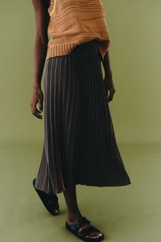 A pima modal blended yarn gives this skirt incredible drape and just the right swishy-ness. Designed using our knitwear knowhow to create beautiful long pleats that will last forever. An elastic band makes it comfortable and easy to wear. Just the right weight to make it light but still weighty for all seasons. Small, contrasting side stripe is a small nod to deadstock design. Rescued 50% Pima cotton / 50% Modal Artisan made in Peru with Fair Trade practices to maintain ethical and responsible i Summer Skirts, Pitcairn Islands, Side Stripe, British Indian, Pima Cotton, Shopping List, Fair Trade, Elastic Band, All Seasons