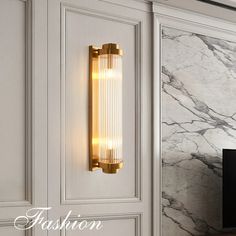 a wall light that is mounted on the side of a cabinet in a living room