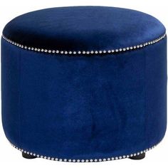 a blue velvet ottoman with studded trimmings on the legs and foot rest