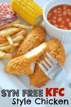 a white plate topped with fried chicken next to french fries and corn on the cob