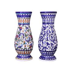 two blue and white vases sitting next to each other