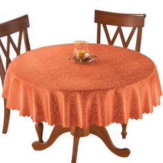 an orange table cloth on top of a wooden chair