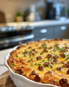 a casserole with meat and cheese in a white dish