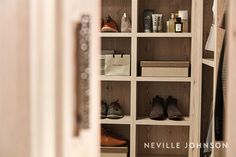 an open closet with shoes and other items