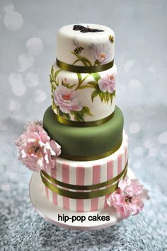 three tiered wedding cake with flowers on top