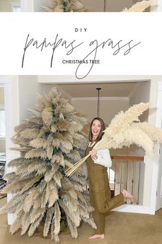 a woman standing next to a fake christmas tree