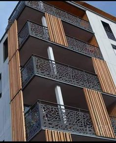 an apartment building with decorative balconies on the side