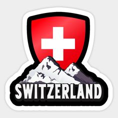 the swiss flag is on top of a red shield with snow capped mountains in the background