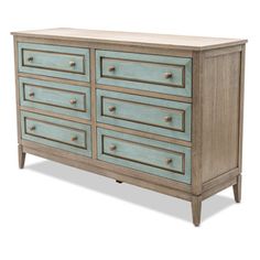 an old dresser with many drawers and knobs on the top, painted in light blue