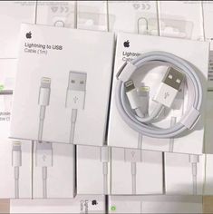 an apple charger and usb cable are in the box for sale at a store