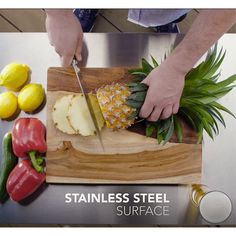 a man cutting up some food on top of a wooden cutting board with a knife