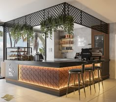 a bar with stools next to it and plants hanging from the ceiling over the counter