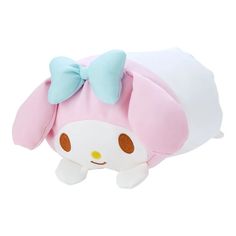 a pink and white stuffed animal with a bow on it's head