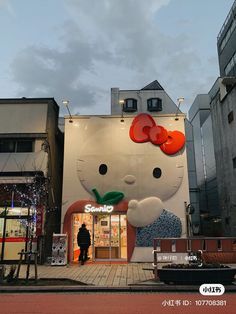 a large hello kitty store in the middle of a city