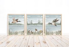 three watercolor paintings of ducks flying over a lake with reeds in the foreground