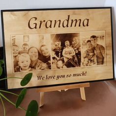 a wooden sign that says, grandma we love you so much with pictures on it