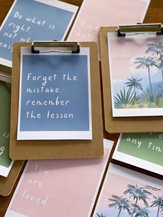 several clipboards with palm trees and words on them