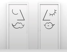 two doors with faces drawn on them in the shape of an eye, nose and mouth