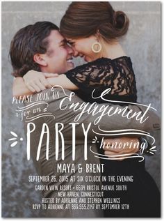 an engagement party with two people hugging each other